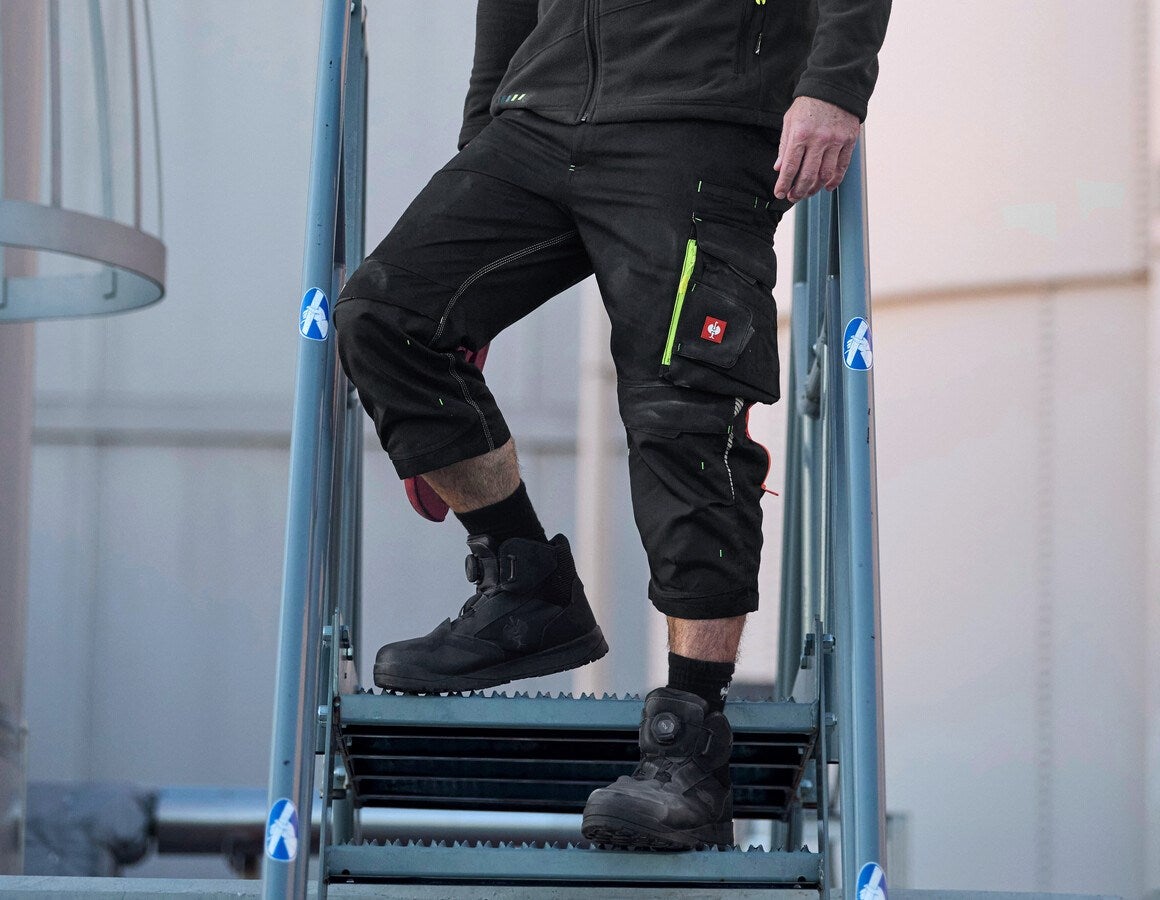 Main action image 3/4 length trousers e.s.motion 2020 black/high-vis yellow/high-vis orange